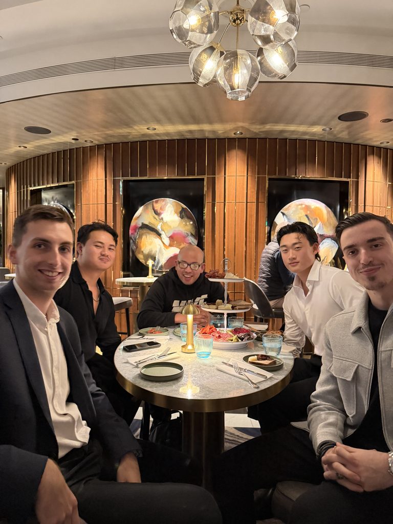 Friends gathered around a dinner table